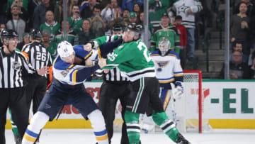 DALLAS, TX - FEBRUARY 21: Brett Ritchie #25 of the Dallas Stars gets physical against Colton Parayko #55 of the St. Louis Blues at the American Airlines Center on February 21, 2019 in Dallas, Texas. (Photo by Glenn James/NHLI via Getty Images)