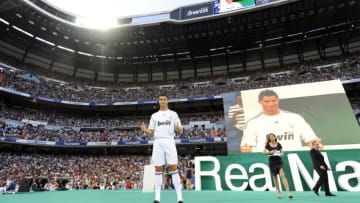 Real Madrid's new player Portuguese Cristiano Ronaldo gives the thumbs up during his official presentation at the Santiago Bernabeu stadium in Madrid on July 6, 2009. Real acquired the 24-year-old Portuguese striker from Manchester United last month on a six-year deal worth 94 million euros (131 million dollars) and Spanish media reports that he will be paid 13 million euros each season. AFP PHOTO / DANI POZO (Photo credit should read Dani Pozo/AFP via Getty Images)