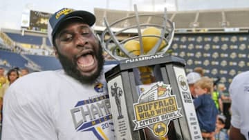Jan 1, 2016; Orlando, FL, USA; Michigan Wolverines tight end A.J. Williams (84) holds the champions trophy after the Michigan Wolverines defeated the Florida Gators 41-7 in the 2016 Citrus Bowl at Orlando Citrus Bowl Stadium. Mandatory Credit: Reinhold Matay-USA TODAY Sports