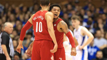 DURHAM, NORTH CAROLINA - JANUARY 18: Teammates Lamarr Kimble #0 and Samuell Williamson #10 of the Louisville Cardinals react after a play against the Duke Blue Devils during their game at Cameron Indoor Stadium on January 18, 2020 in Durham, North Carolina. (Photo by Streeter Lecka/Getty Images)
