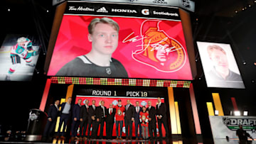 VANCOUVER, BRITISH COLUMBIA - JUNE 21: Lassi Thomson reacts after being selected nineteenth overall by the Ottawa Senators during the first round of the 2019 NHL Draft at Rogers Arena on June 21, 2019 in Vancouver, Canada. (Photo by Bruce Bennett/Getty Images)