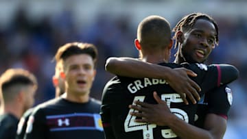 IPSWICH, ENGLAND - APRIL 21: Lewis Grabban of Aston Villa celebrates scoring the third goal of the game with team mate Josh Odomah during the Sky Bet Championship match between Ipswich Town and Aston Villa at Portman Road on April 21, 2018 in Ipswich, England. (Photo by Stephen Pond/Getty Images)