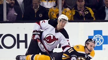 Oct 20, 2016; Boston, MA, USA; Boston Bruins right wing Jimmy Hayes (11) gets tangled up with New Jersey Devils defenseman John Moore (2) during the third period of the Boston Bruins 2-1 win over the New Jersey Devils at TD Garden. Mandatory Credit: Winslow Townson-USA TODAY Sports