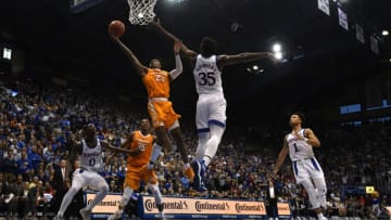 LAWRENCE, KANSAS - JANUARY 25: Jordan Bowden #23 of the Tennessee Volunteers lays the ball up against Udoka Azubuike #35 of the Kansas Jayhawks in the second half at Allen Fieldhouse on January 25, 2020 in Lawrence, Kansas. (Photo by Ed Zurga/Getty Images)
