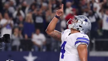 ARLINGTON, TX - DECEMBER 18: Dak Prescott #4 of the Dallas Cowboys celebrates after scoring a touchdown during the second quarter against the Tampa Bay Buccaneers at AT&T Stadium on December 18, 2016 in Arlington, Texas. (Photo by Tom Pennington/Getty Images)