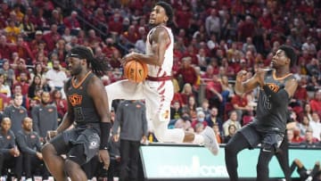 Iowa State Cyclones guard Izaiah Brockington (1) drives as Oklahoma State Cowboys Keylan Boone (20) defends during the first half at Hilton Coliseum Wednesday, March 2, 2022, in Ames, Iowa.