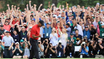 AUGUSTA, GEORGIA - APRIL 14: Tiger Woods of the United States celebrates after sinking his putt on the 18th green to win during the final round of the Masters at Augusta National Golf Club on April 14, 2019 in Augusta, Georgia. (Photo by David Cannon/Getty Images)