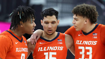 LAS VEGAS, NEVADA - NOVEMBER 20: Terrence Shannon Jr. #0, RJ Melendez #15 and Coleman Hawkins #33 of the Illinois Fighting Illini talk on the court in the first half of the championship game of the Continental Tire Main Event basketball tournament against the Virginia Cavaliers at T-Mobile Arena on November 20, 2022 in Las Vegas, Nevada. The Cavaliers defeated the Fighting Illini 70-61. (Photo by Ethan Miller/Getty Images)