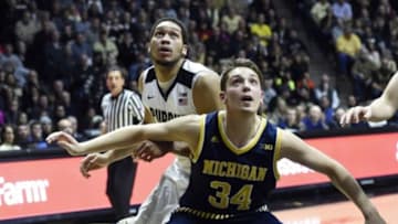 Jan 7, 2016; West Lafayette, IN, USA; Purdue Boilermakers center A.J. Hammons (20) and Michigan Wolverines forward Mark Donnal (34) wait for a rebound in the second half at Mackey Arena. Purdue won the game 87-70. Mandatory Credit: Sandra Dukes-USA TODAY Sports