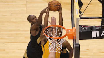 TORONTO, ON - JANUARY 26: Derrick Favors #15 of the Utah Jazz is blocked by Serge Ibaka #9 of the Toronto Raptors and Jonas Valanciunas #17 at Air Canada Centre on January 26, 2018 in Toronto, Canada. NOTE TO USER: User expressly acknowledges and agrees that, by downloading and or using this photograph, User is consenting to the terms and conditions of the Getty Images License Agreement. (Photo by Tom Szczerbowski/Getty Images)