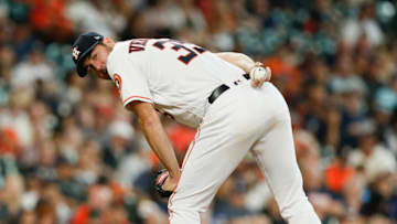 HOUSTON, TX - MAY 23: Justin Verlander #35 of the Houston Astros checks the runner at first base in the fifth inning against the San Francisco Giants at Minute Maid Park on May 23, 2018 in Houston, Texas. (Photo by Bob Levey/Getty Images)