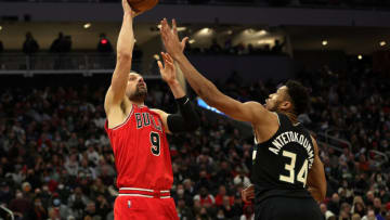 MILWAUKEE, WISCONSIN - JANUARY 21: Nikola Vucevic #9 of the Chicago Bulls shoots over Giannis Antetokounmpo #34 of the Milwaukee Bucks during the first half of a game at Fiserv Forum on January 21, 2022 in Milwaukee, Wisconsin. NOTE TO USER: User expressly acknowledges and agrees that, by downloading and or using this photograph, User is consenting to the terms and conditions of the Getty Images License Agreement. (Photo by Stacy Revere/Getty Images)