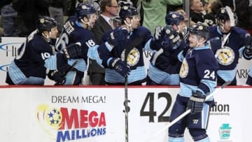 March 30, 2013; Pittsburgh, PA, USA; Pittsburgh Penguins left wing Matt Cooke (24) celebrates after scoring a goal against the New York Islanders during the third period at the CONSOL Energy Center. The Pittsburgh Penguins won 2-0. Mandatory Credit: Charles LeClaire-USA TODAY Sports