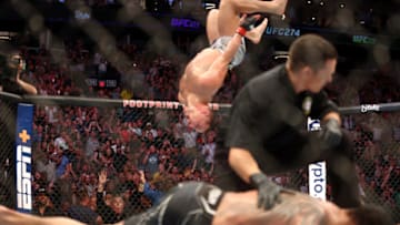 May 7, 2022; Phoenix, Arizona, USA; Spectators react as Michael Chandler does a backflip in celebration of his knockout victory against Tony Ferguson during UFC 274 at Footprint Center. Mandatory Credit: Mark J. Rebilas-USA TODAY Sports