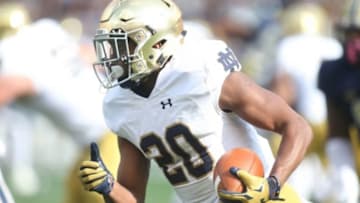 Nov 7, 2015; Pittsburgh, PA, USA; Notre Dame Fighting Irish running back C.J. Prosise (20) runs the ball against the Pittsburgh Panthers during the first quarter at Heinz Field. Notre Dame won 42-30. Mandatory Credit: Charles LeClaire-USA TODAY Sports