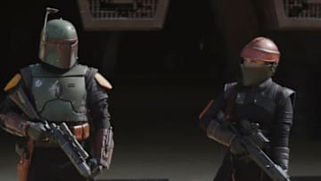 (L-R): Boba Fett (Temuera Morrison) and Fennec Shand (Ming-Na Wen) in Lucasfilm's THE BOOK OF BOBA FETT, exclusively on Disney+. © 2022 Lucasfilm Ltd. & ™. All Rights Reserved.