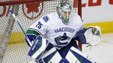 Mar 18, 2016; Edmonton, Alberta, CAN; Vancouver Canucks goaltender Jacob Markstrom (25) makes a save during warmup against the Edmonton Oilers at Rexall Place. Mandatory Credit: Perry Nelson-USA TODAY Sports