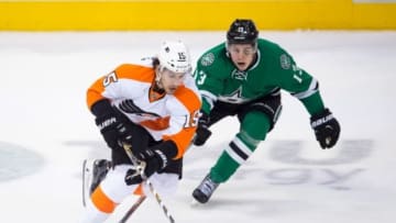 Dec 11, 2015; Dallas, TX, USA; Philadelphia Flyers defenseman Michael Del Zotto (15) and Dallas Stars center Mattias Janmark (13) in action during the game at the American Airlines Center. The Stars defeat the Flyers 3-1. Mandatory Credit: Jerome Miron-USA TODAY Sports