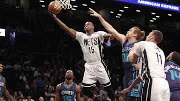 Nov 4, 2016; Brooklyn, NY, USA; Brooklyn Nets guard Isaiah Whitehead (15) puts up a shot against Charlotte Hornets forward Spencer Hawes (00) in the first quarter at Barclays Center. Mandatory Credit: Nicole Sweet-USA TODAY Sports