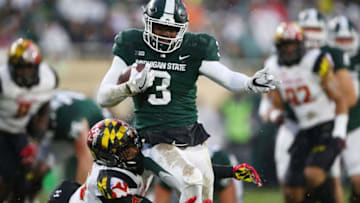 EAST LANSING, MI - NOVEMBER 18: LJ Scott #3 of the Michigan State Spartans tries to run through the tackle of Antoine Brooks Jr. #25 of the Maryland Terrapins during the first half at Spartan Stadium on November 18, 2017 in East Lansing, Michigan. (Photo by Gregory Shamus/Getty Images)