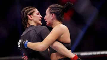 HOUSTON, TEXAS - FEBRUARY 12: Casey O’Neill (R) of Scotland and Roxanne Modafferi embrace after their women’s flyweight fight during UFC 271 at Toyota Center on February 12, 2022 in Houston, Texas. (Photo by Carmen Mandato/Getty Images)