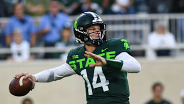 EAST LANSING, MI - SEPTEMBER 07: Michigan State quarterback Brian Lewerke (14) drops back to pass during a college football game between the Michigan State Spartans and Western Michigan Broncos on September 7, 2019 at Spartan Stadium in East Lansing, MI. (Photo by Adam Ruff/Icon Sportswire via Getty Images)