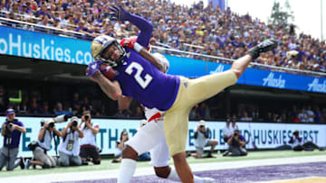 SEATTLE, WASHINGTON - AUGUST 31: Aaron Fuller #2 of the Washington Huskies completes a seven yard touchdown pass against Darreon Moore #26 of the Eastern Washington Eagles in the first quarter during their game at Husky Stadium on August 31, 2019 in Seattle, Washington. (Photo by Abbie Parr/Getty Images)