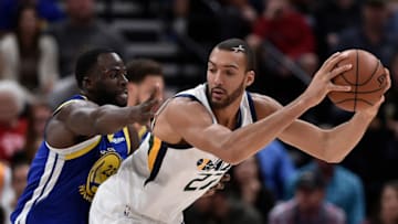 SALT LAKE CITY, UT - OCTOBER 19: Draymond Green #23 of the Golden State Warriors defends against Rudy Gobert #27 of the Utah Jazz in the first half of a NBA game at Vivint Smart Home Arena on October 19, 2018 in Salt Lake City, Utah. NOTE TO USER: User expressly acknowledges and agrees that, by downloading and or using this photograph, User is consenting to the terms and conditions of the Getty Images License Agreement. (Photo by Gene Sweeney Jr./Getty Images)