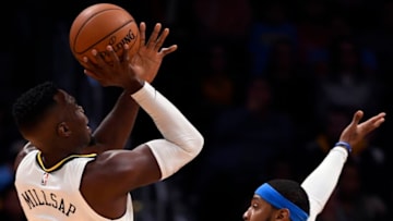 DENVER, CO - OCTOBER 10: Denver Nuggets forward Paul Millsap (4) takes a shot over Oklahoma City Thunder forward Carmelo Anthony (7) on October 10, 2017 in Denver, Colorado at Pepsi Center. (Photo by John Leyba/The Denver Post via Getty Images)