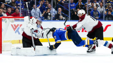 ST. LOUIS, MO - MARCH 15: St. Louis Blues' Jaden Schwartz, center, is hit and knocked to the ice by Colorado Avalanche's Patrik Nemeth in front of goaltender Semyon Varlamov (1) during the first period of an NHL hockey game between the St. Louis Blues and the Colorado Avalanche on March 15, 2018, at Scottrade Center in St. Louis, MO. (Photo by Tim Spyers/Icon Sportswire via Getty Images)