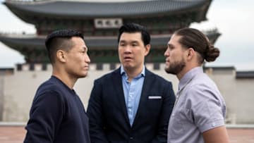 SEOUL, SOUTH KOREA - OCTOBER 17: Brian Ortega(right) and Chan Sung Jung also known as Korean Zombie face off in front of Gwanghwamun in Seoul, South Korea on October 17, 2019 with Kevin Zhang(center), the UFC Senior Vice President for Asia Pacific ahead of the mixed martial arts event produced by the Ultimate Fighting Championship that is planned to take place in December in Busan, Korea. (Photo by Woohae Cho/Zuffa LLC)