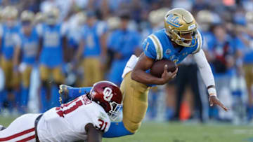 LOS ANGELES, CALIFORNIA - SEPTEMBER 14: Jalen Redmond #31 of the Oklahoma Sooners sacks Dorian Thompson-Robinson #1 of the UCLA Bruins during the first half of a game on at the Rose Bowl on September 14, 2019 in Los Angeles, California. (Photo by Sean M. Haffey/Getty Images)