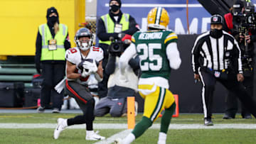 GREEN BAY, WISCONSIN - JANUARY 24: Scott Miller #10 of the Tampa Bay Buccaneers completes a touchdown reception in the second quarter against the Green Bay Packers during the NFC Championship game at Lambeau Field on January 24, 2021 in Green Bay, Wisconsin. (Photo by Dylan Buell/Getty Images)