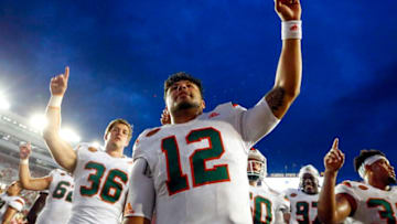 TALLAHASSEE, FL- OCTOBER 7: Quarterback Malik Rosier #12 of the Miami Hurricanes celebrates with teammates after they defeated the Florida State Seminoles 24-20 during the second half of an NCAA football game at Doak S. Campbell Stadium on October 7, 2017 in Tallahassee, Florida. (Photo by Butch Dill/Getty Images)