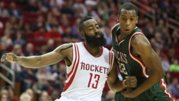Feb 6, 2015; Houston, TX, USA; Houston Rockets guard James Harden (13) boxes out Milwaukee Bucks guard Khris Middleton (22) in the second half at Toyota Center. Rockets won 117 to 111. Mandatory Credit: Thomas B. Shea-USA TODAY Sports