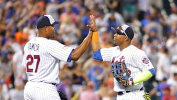 Jul 4, 2016; New York City, NY, USA; New York Mets pitcher Jeurys Familia (27) and center fielder Yoenis Cespedes (52) react after defeating the Miami Marlins at Citi Field. The Mets won 8-6. Mandatory Credit: Andy Marlin-USA TODAY Sports