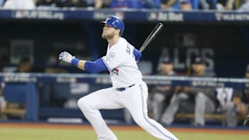 Oct 17, 2016; Toronto, Ontario, CAN; Toronto Blue Jays designated hitter Michael Saunders (21) hits a solo home run against the Cleveland Indians during the second inning in game three of the 2016 ALCS playoff baseball series at Rogers Centre. Mandatory Credit: John E. Sokolowski-USA TODAY Sports