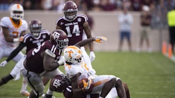 Oct 8, 2016; College Station, TX, USA; Tennessee Volunteers running back Alvin Kamara (6) is brought down by Texas A&M Aggies defensive lineman Zaycoven Henderson (92) during the second quarter at Kyle Field. Mandatory Credit: Jerome Miron-USA TODAY Sports
