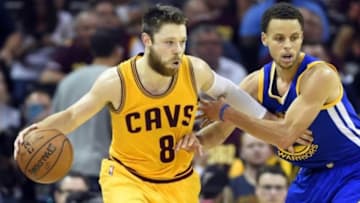 Jun 11, 2015; Cleveland, OH, USA; Cleveland Cavaliers guard Matthew Dellavedova (8) handles the ball against Golden State Warriors guard Stephen Curry (30) during the second quarter in game four of the NBA Finals at Quicken Loans Arena. Mandatory Credit: Bob Donnan-USA TODAY Sports