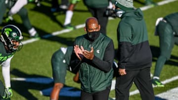 Michigan State's head coach Mel Tucker walks around teammates during warm ups before the game against Northwestern on Saturday, Nov. 28, 2020, at Spartan Stadium in East Lansing.201128 Msu Northwestern 014a