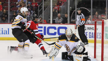 Sep 16, 2019; Newark, NJ, USA; Boston Bruins goaltender Kyle Keyser (85) makes a save on New Jersey Devils center Travis Zajac (19) during the second period at Prudential Center. Mandatory Credit: Ed Mulholland-USA TODAY Sports