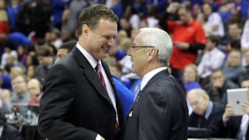 KANSAS CITY, MO - MARCH 24: (L-R) Head coach Bill Self of the Kansas Jayhawks greets head coach Roy Williams of the North Carolina Tar Heels prior to coaching against each other during the third round of the 2013 NCAA Men's Basketball Tournament at Sprint Center on March 24, 2013 in Kansas City, Missouri. (Photo by Ed Zurga/Getty Images)