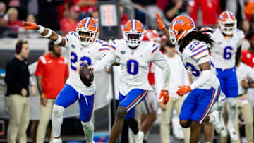 Florida Gators safety Trey Dean III (0) celebrates with Florida Gators safety Rashad Torrence II (22) and Florida Gators cornerback Jaydon Hill (23) after recovering a fumble during the second half against the Georgia Bulldogs at TIAA Bank Field in Jacksonville, FL on Saturday, October 29, 2022. [Matt Pendleton/Gainesville Sun]Ncaa Football Florida Gators Vs Georgia Bulldogs
