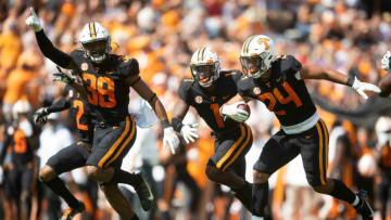 Oct 9, 2021; Knoxville, TN, USA; From left, Tennessee linebacker Solon Page III (38), defensive back Trevon Flowers (1), and linebacker Aaron Beasley (24) celebrate a fumble recovery against South Carolina in the NCAA college football game between the Tennessee Volunteers and the South Carolina Gamecocks in Knoxville, Tenn. on Saturday, October 9, 2021. Mandatory Credit: Brianna Paciorka-USA TODAY Sports