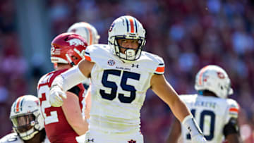 Auburn footballFAYETTEVILLE, ARKANSAS - OCTOBER 16: Eku Leota #55 of the Auburn Tigers at the line of scrimmage during a game against the Arkansas Razorbacks at Donald W. Reynolds Stadium on October 16, 2021 in Fayetteville, Arkansas. The Tigers defeated the Razorbacks 38-23. (Photo by Wesley Hitt/Getty Images)