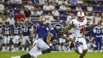 Sep 19, 2015; Fort Worth, TX, USA; Southern Methodist Mustangs defensive back Horace Richardson (9) intercepts a ball and is chased by TCU Horned Frogs wide receiver Josh Doctson (9) during the game at Amon G. Carter Stadium. Mandatory Credit: Kevin Jairaj-USA TODAY Sports