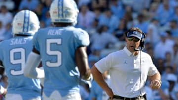 CHAPEL HILL, NC - OCTOBER 14: Head coach Larry Fedora talks to K.J. Sails