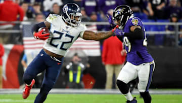 BALTIMORE, MARYLAND - JANUARY 11: Derrick Henry #22 of the Tennessee Titans carries the ball against Earl Thomas #29 of the Baltimore Ravens during the AFC Divisional Playoff game at M&T Bank Stadium on January 11, 2020 in Baltimore, Maryland. (Photo by Will Newton/Getty Images)