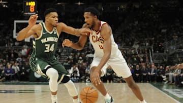 Dec 6, 2021; Milwaukee, Wisconsin, USA; Cleveland Cavaliers center Evan Mobley (4) drives to the basket against Milwaukee Bucks forward Giannis Antetokounmpo (34) in the first quarter at Fiserv Forum. Mandatory Credit: Michael McLoone-USA TODAY Sports