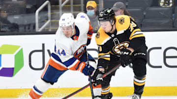 May 10, 2021; Boston, Massachusetts, USA; New York Islanders center Jean-Gabriel Pageau (44) battles with Boston Bruins defenseman Charlie McAvoy (73) during overtime at TD Garden. Mandatory Credit: Bob DeChiara-USA TODAY Sports